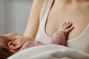 Can You Breastfeed After a Breast Reduction? 1 mother nursing infant